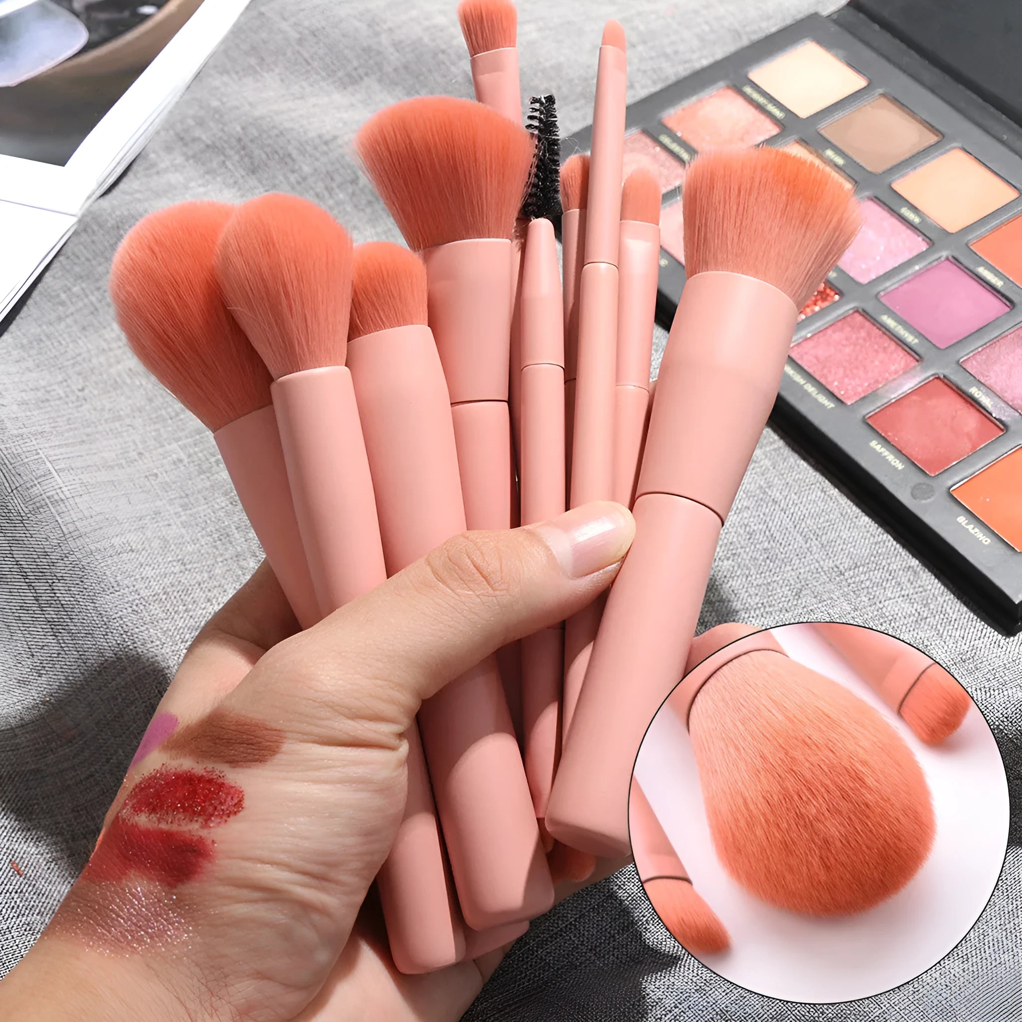 Ten makeup brushes with wooden handles arranged showing different brush head types including powder, foundation and double-headed tools