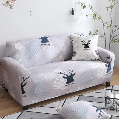 Geometric patterned stretch sofa slipcover fitted on a modern two-seater sofa.