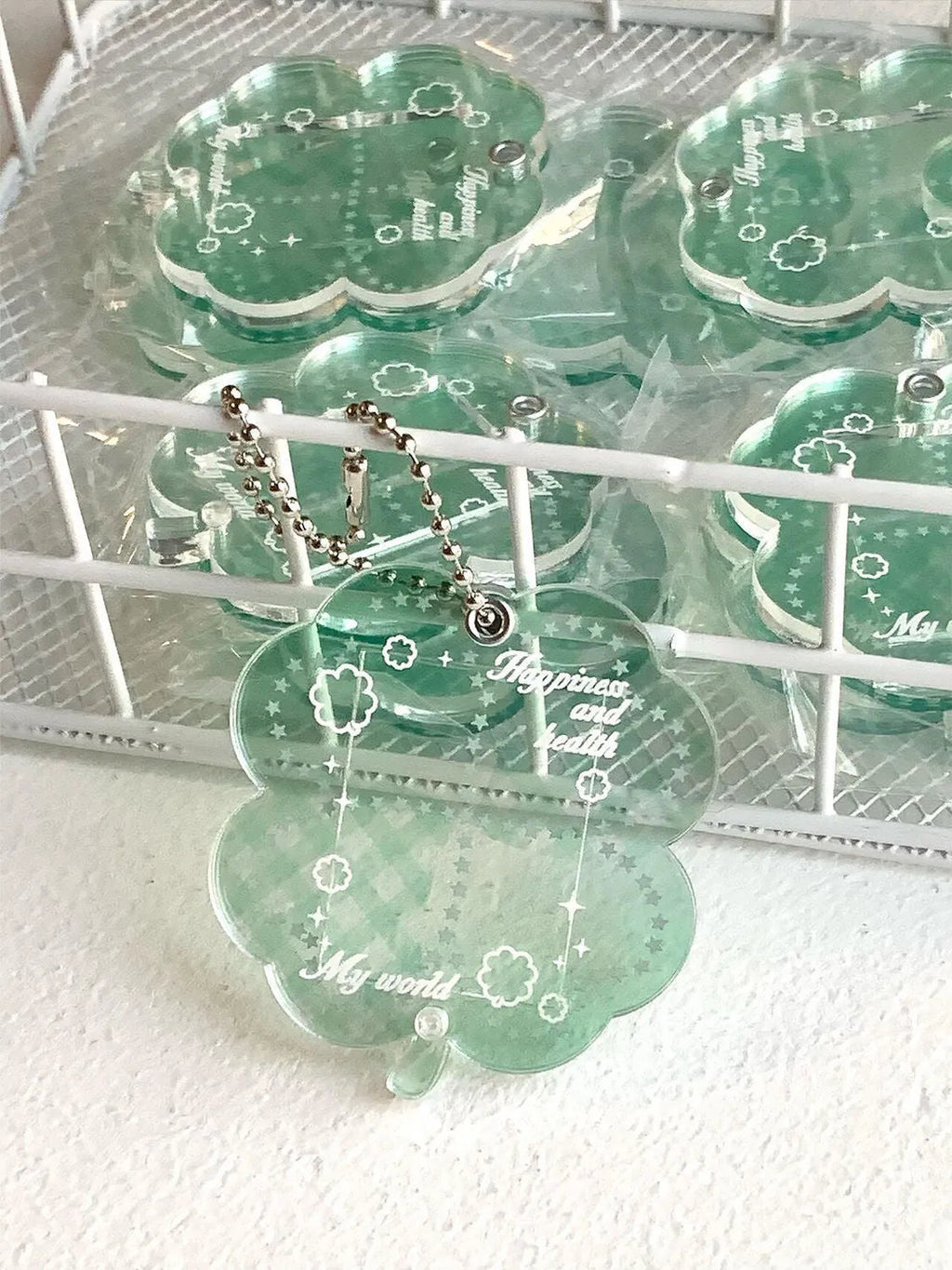 Acrylic four-leaf clover pendant keychain in blue, grass green, or mint green.