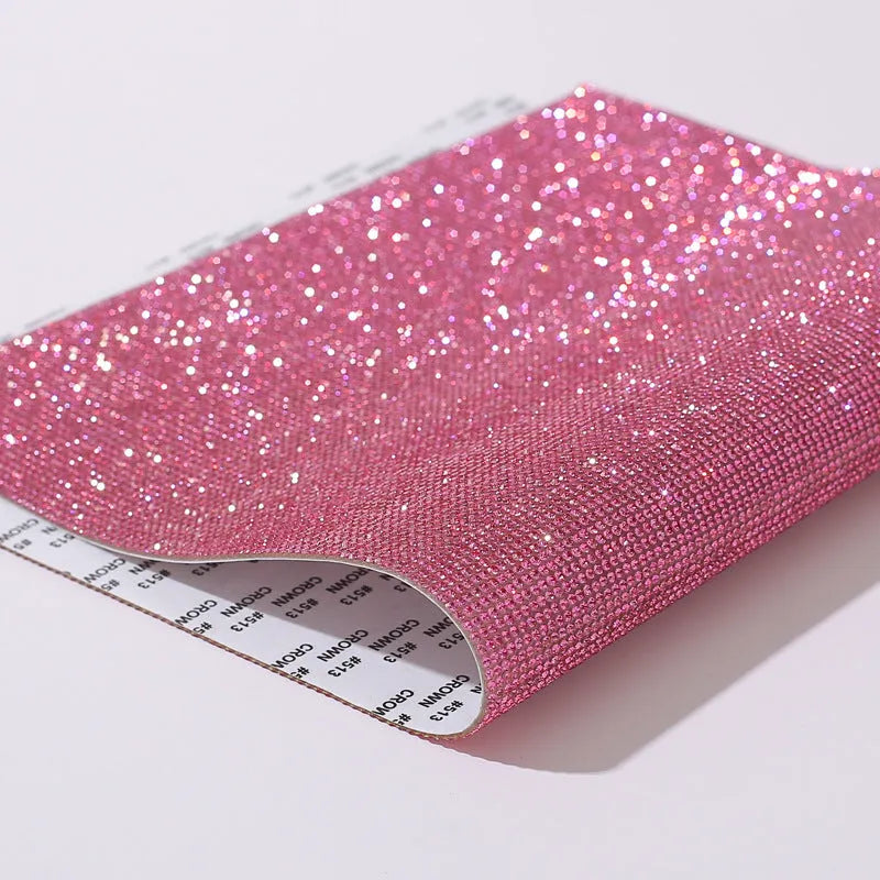 Rhinestone transfer sheet with hot fix glue backing showing eight-eye pattern in multiple colour options
