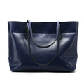 Brown wax cowhide leather handbag showing internal compartments and crossbody strap