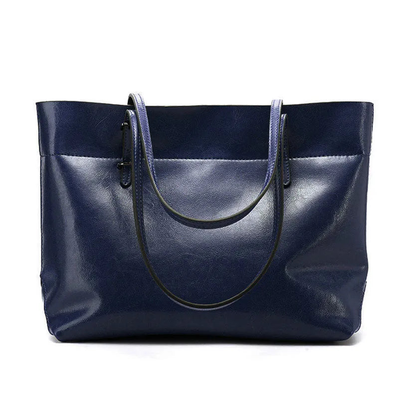 Brown wax cowhide leather handbag showing internal compartments and crossbody strap