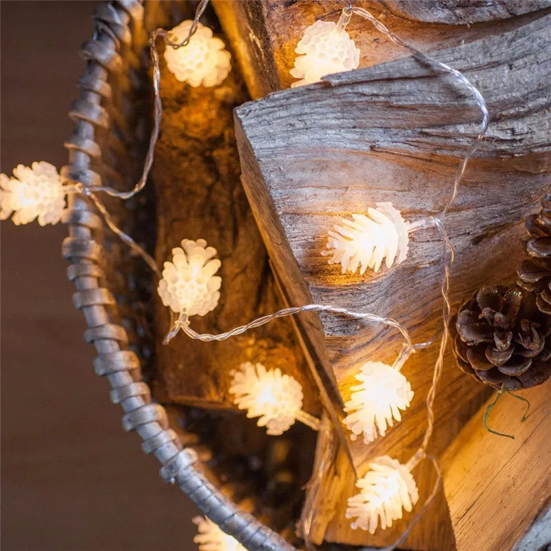 Warm white LED pine cone battery-powered string light draped decoratively