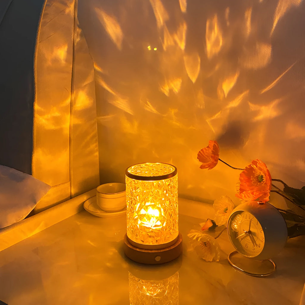 Rotating water ripple night light with acrylic dome on a solid wood base.