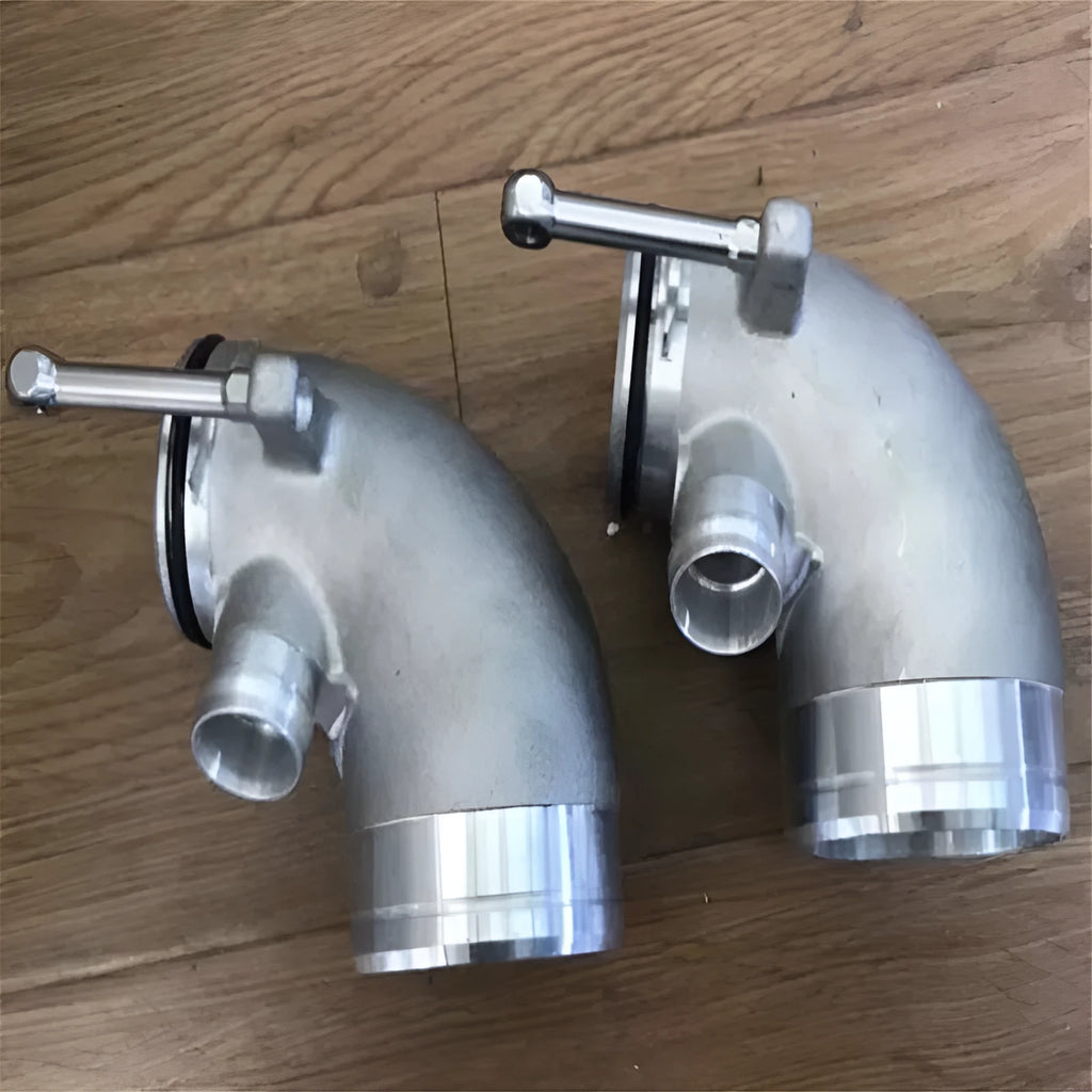 Modified plus-sized 90 degree automotive turbine pipe in aluminium alloy for lateral engine positioning