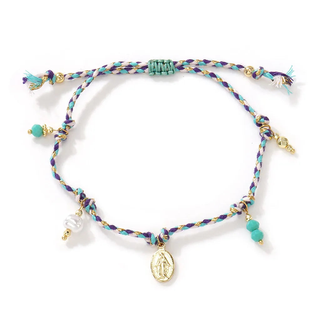 Close-up of a hand-woven colourful braided rope bracelet with an adjustable strap tag, showing ethnic style design.