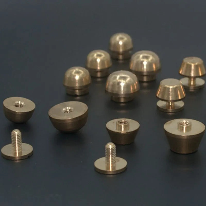 Brass decorative foot nail buckles in round and bucket shapes, sizes 10x6mm and 12x7mm.