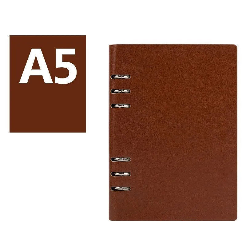Loose-leaf business notebook with imitation leather cover in multiple colours, open to show beige paper.