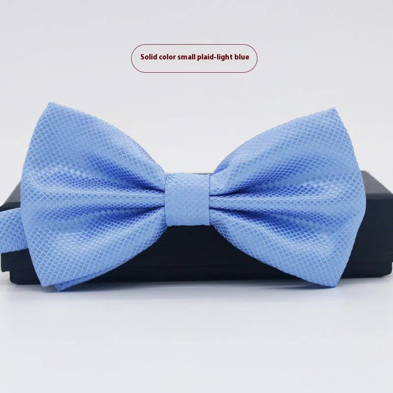 Men's flat head style polyester bow tie in a solid colour, shown with adjustable neck strap.