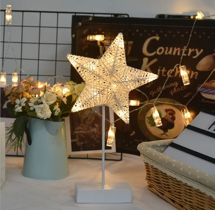 Rattan star-shaped LED lamp with copper wire frame measuring 23x40cm