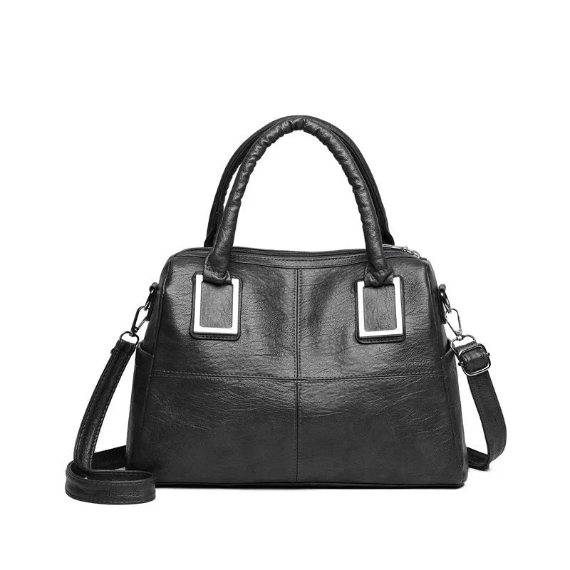 Women's square shoulder bag showing internal phone pocket and document compartment in neutral colour