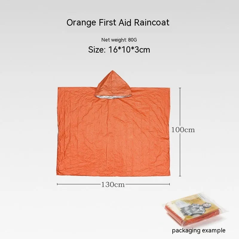 Orange emergency relief tent with sleeping bag and raincoat in temporary outdoor shelter setup