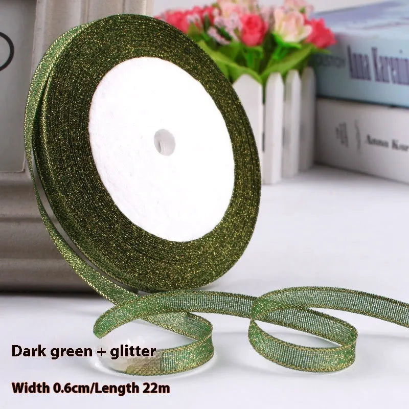 Roll of 0.6cm wide polyester gift ribbon in various colours including gold leaf, coffee and sky blue options