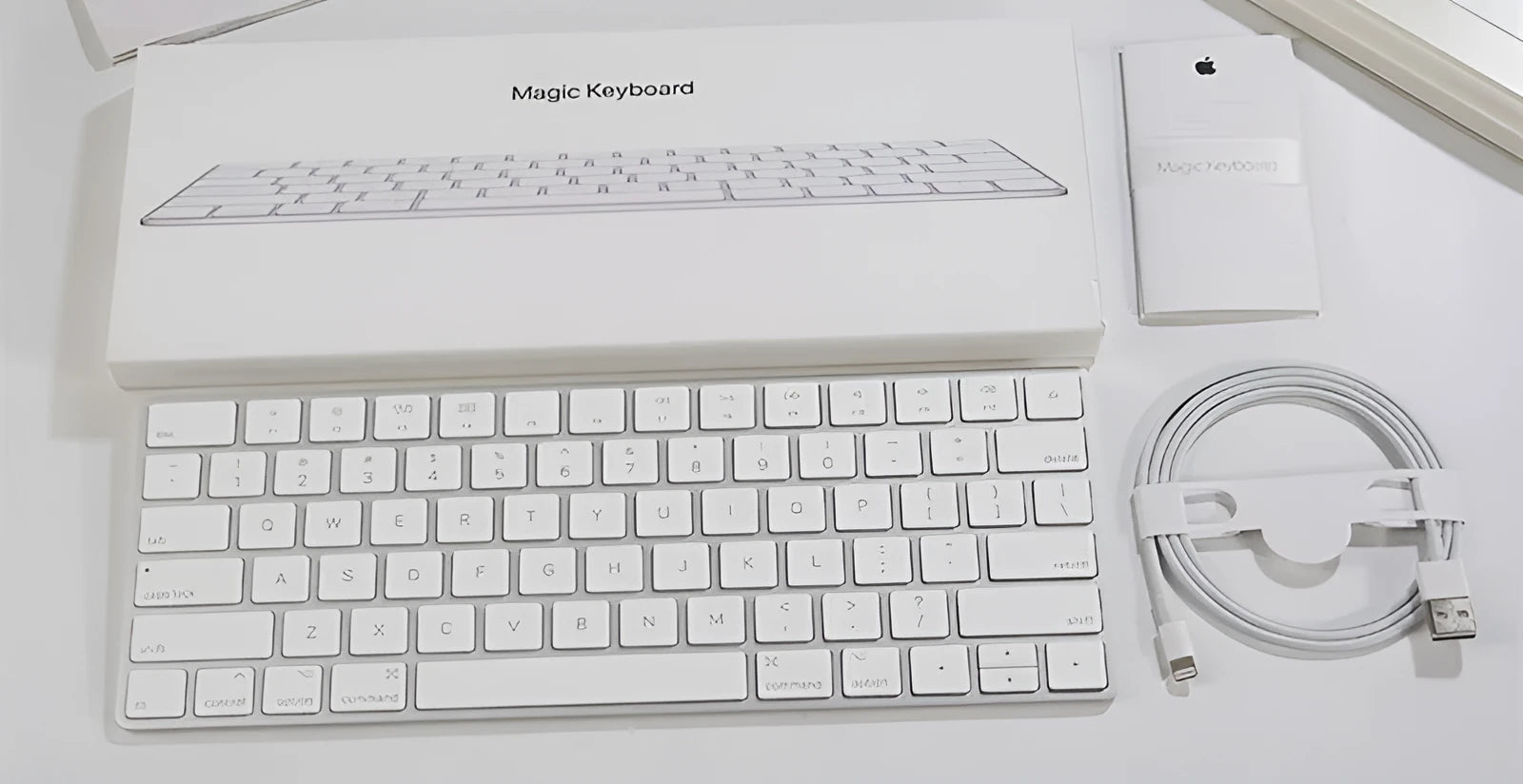 Apple white metal Bluetooth wireless keyboard with ultra-thin design and multimedia keys