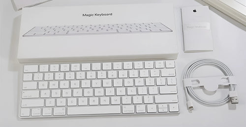 Apple white metal Bluetooth wireless keyboard with ultra-thin design and multimedia keys