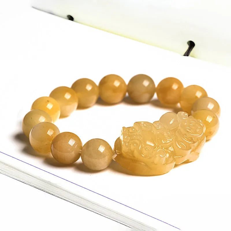 Golden thread jade bracelet with hand-carved money design showing two size options with jade beads