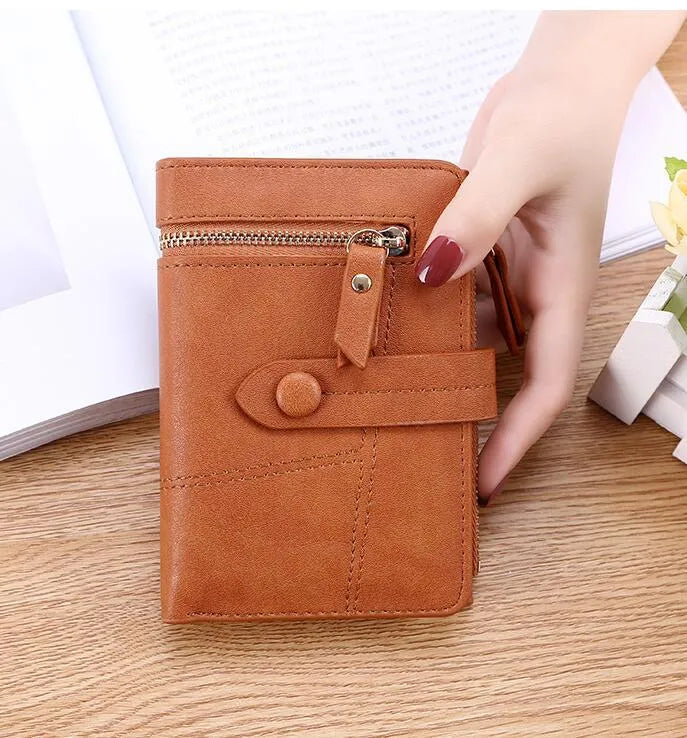 Faux leather standard short wallet with zipper closure, solid colour, showing multiple internal compartments