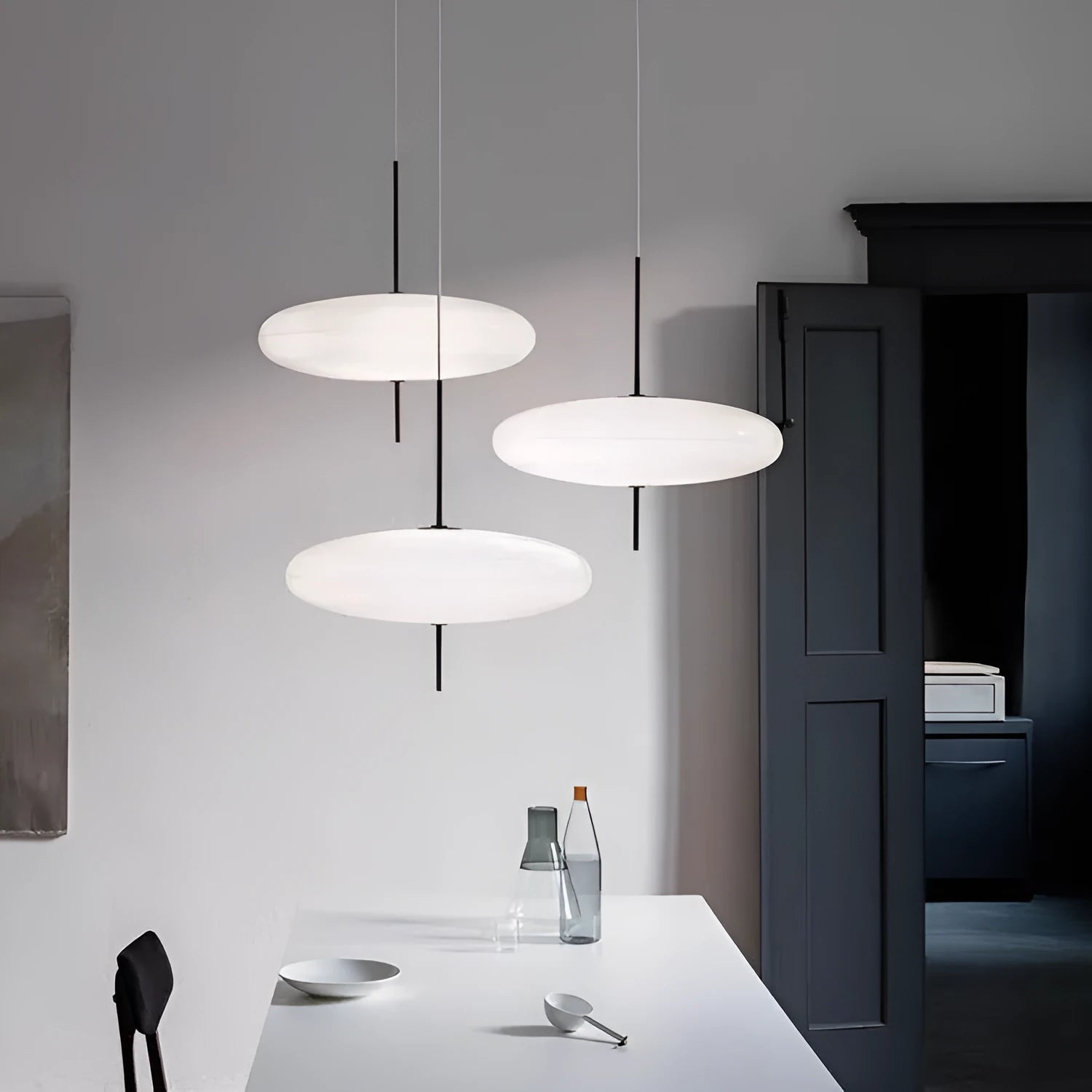 Nordic modern retro UFO pendant chandelier light fitting in a black and white colour scheme.