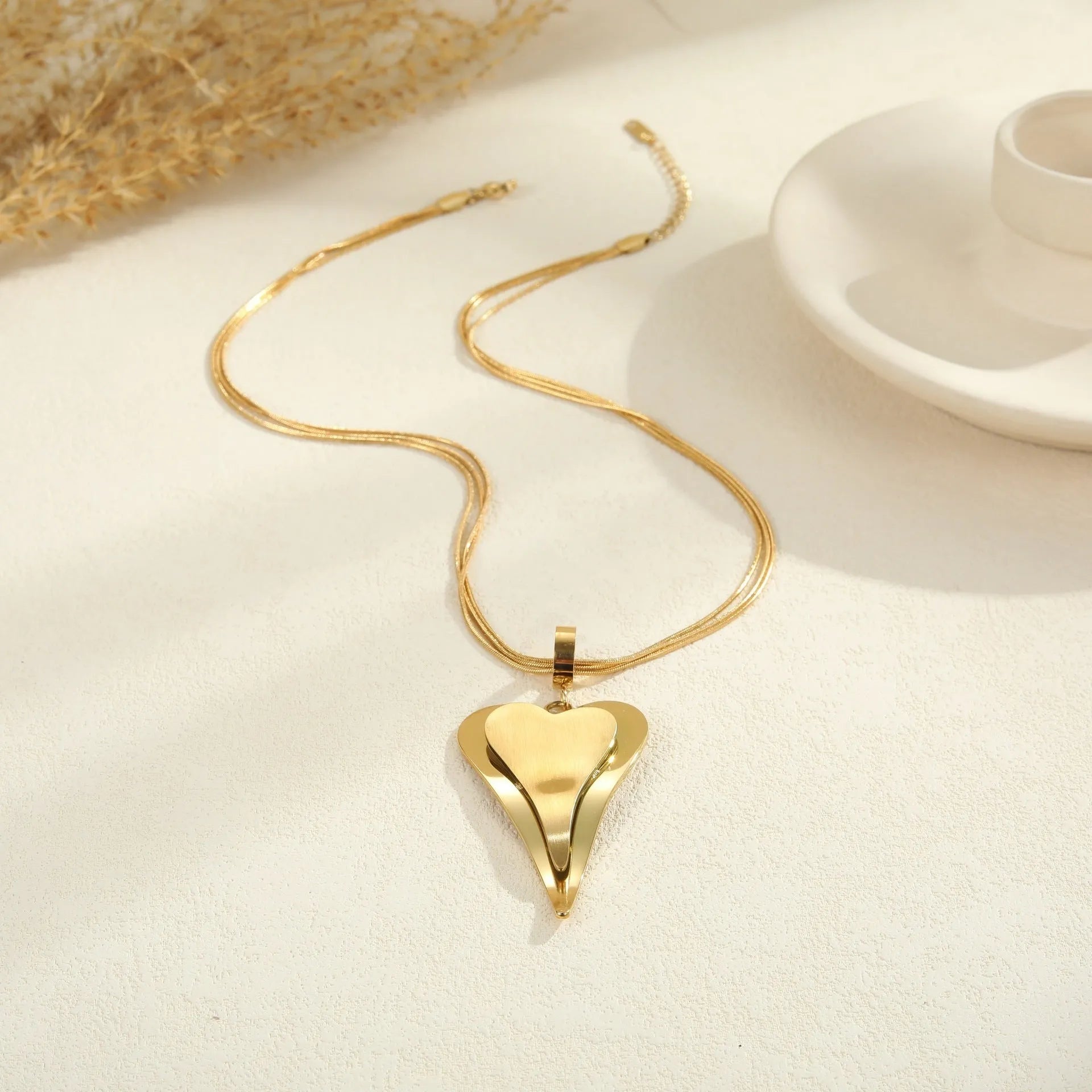Women's stainless steel double heart snake bones chain necklace with geometric pendant