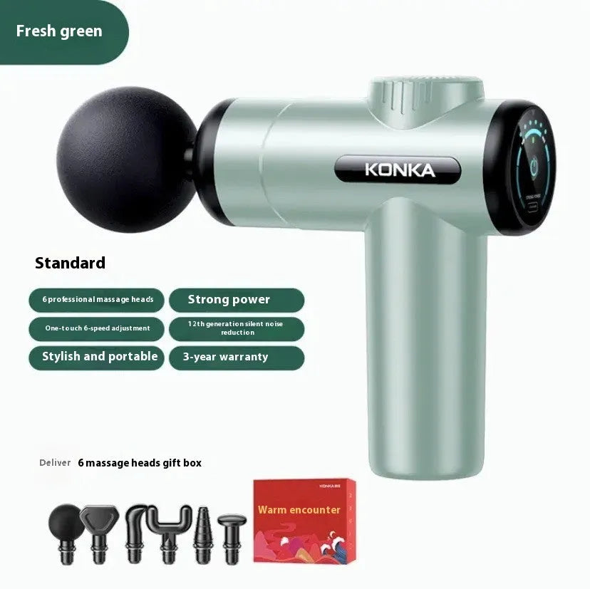 Konka professional electric mini massage gun in grey colour with multiple massage head attachments on a table.