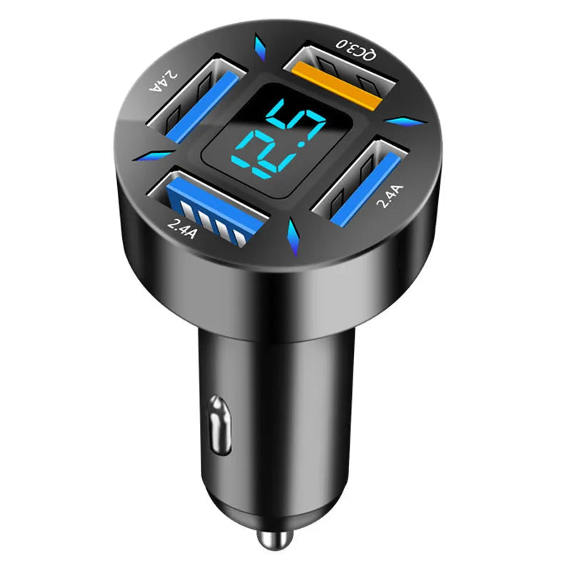 Black four-port USB car charger with digital LED display, shown plugged into a car dashboard.