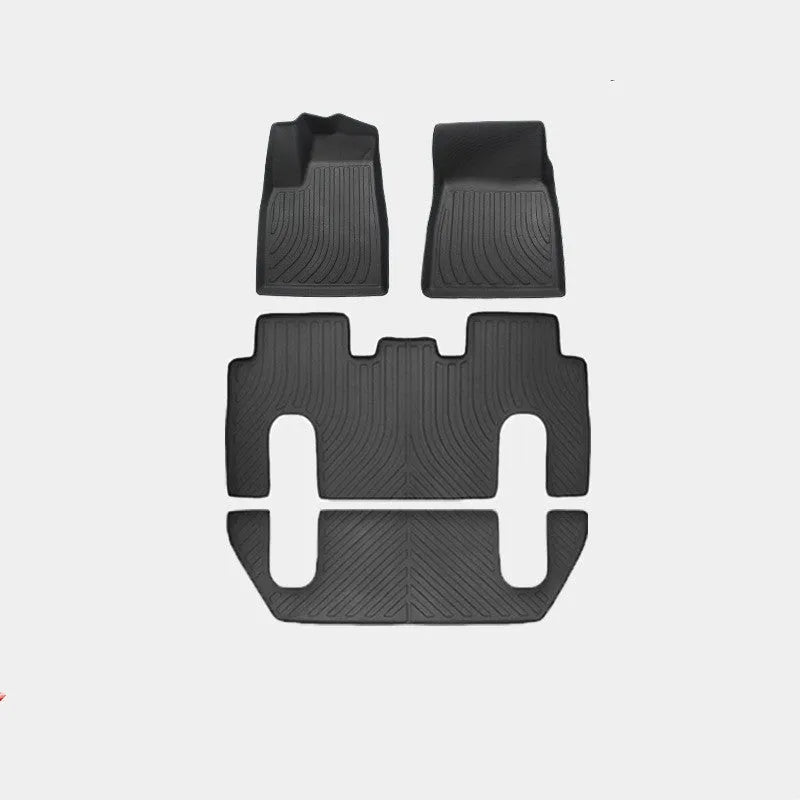 Rubber floor mat set for Tesla Model X showing foot pads and tailbox cushion for interior protection