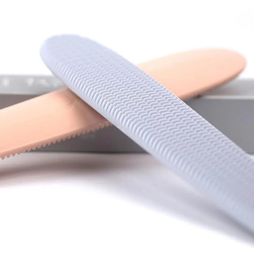 Grey and pink ABS plastic cat grooming comb with tongue-mimicking massage design