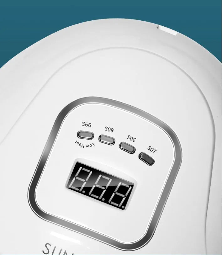 White nail drying lamp with UV and LED lights showing digital timer display