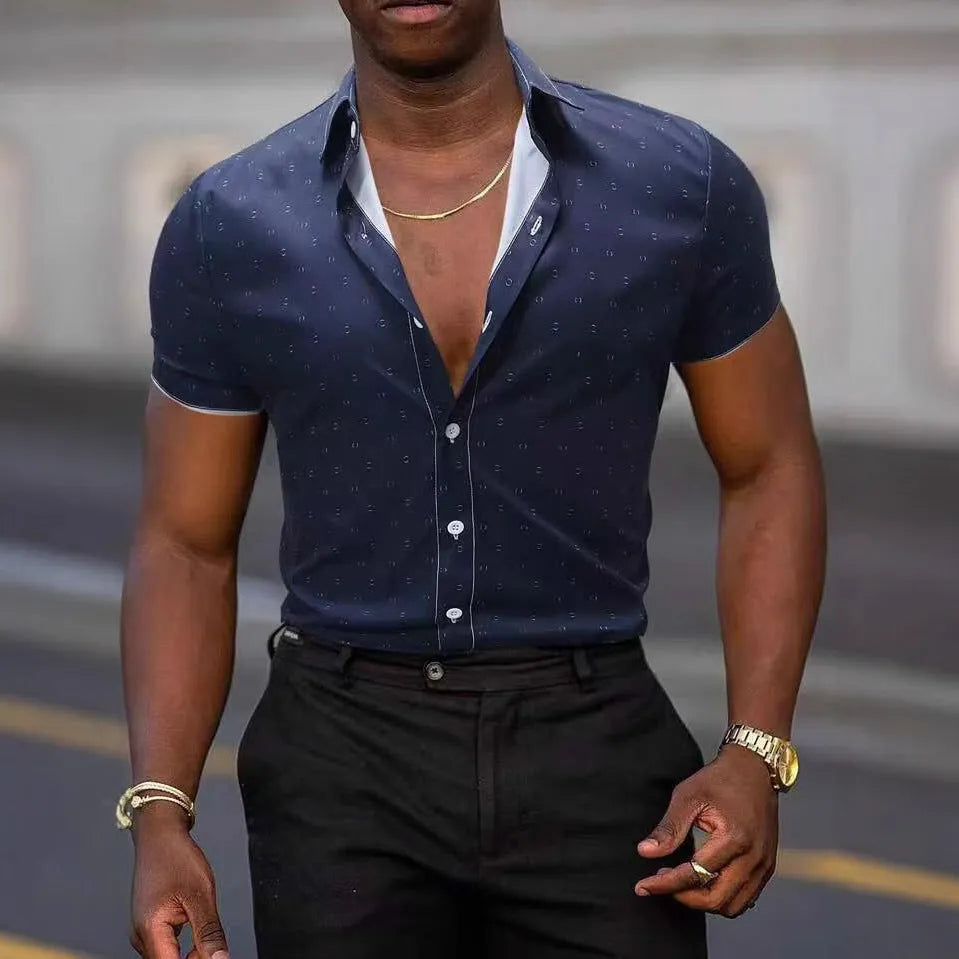 Man wearing light blue short-sleeved shirt with floral pattern, made from stretch polyester fabric