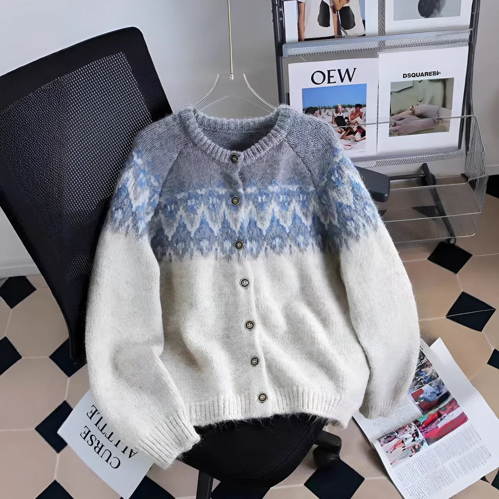 Women's beige jacquard knit sweater coat with contrast pattern, shown with long sleeves and a loose fit.