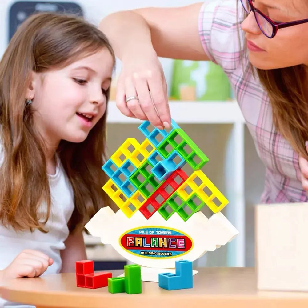 Colourful plastic balance stacking game with blocks, chassis, and base on a table