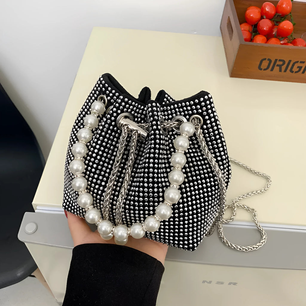 Diamond pattern women's crossbody bag in PU leather with metal chain strap, showing internal phone pocket and change purse.