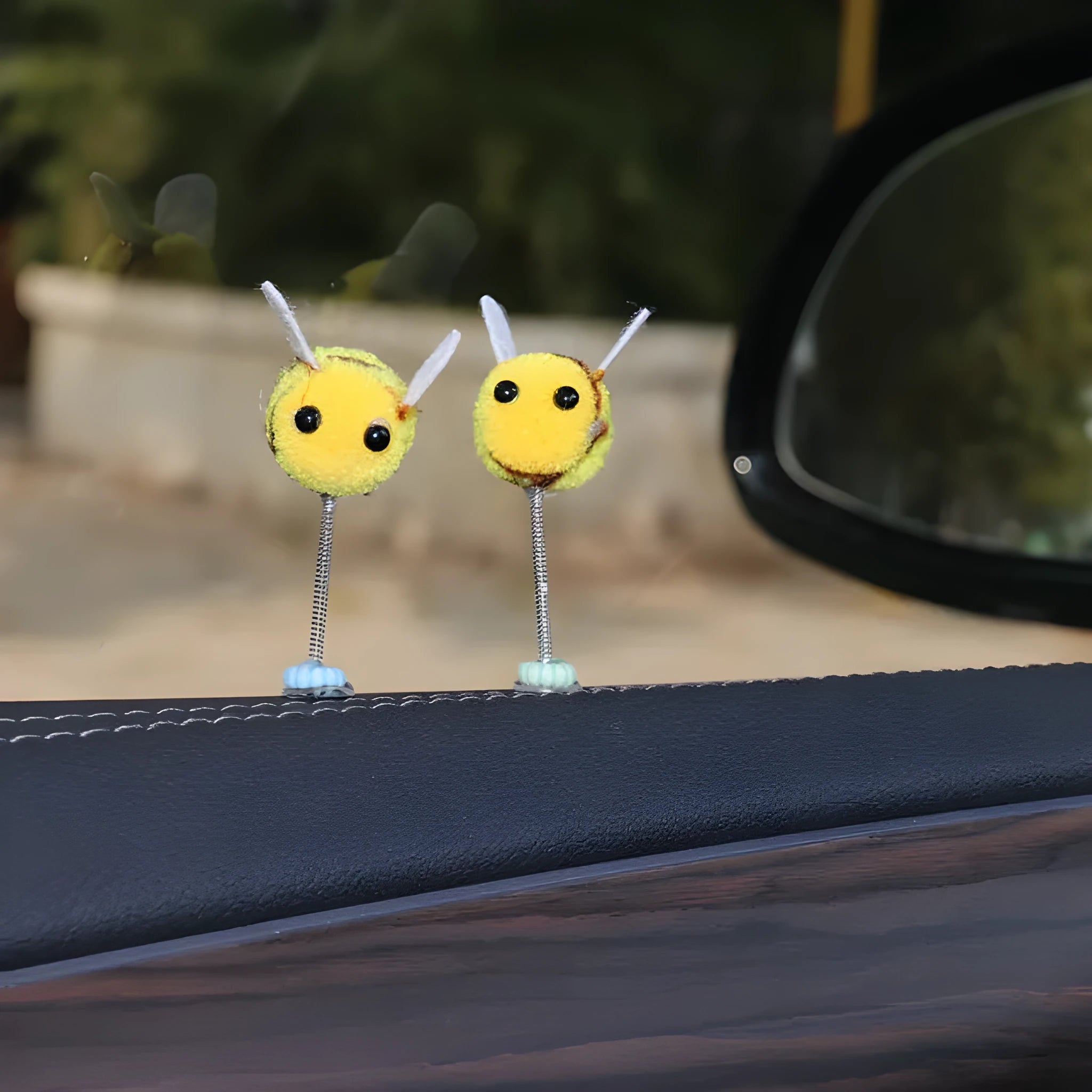 Soft fur ball bee car decoration measuring 3x3 centimetres with cartoon design