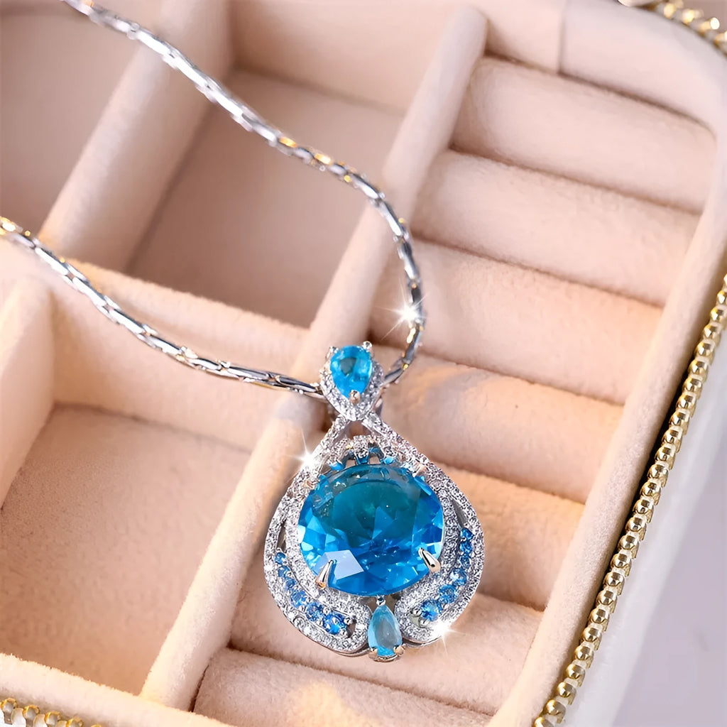 Blue geometric crystal pendant necklace with fireworks cut on a water wave chain for women