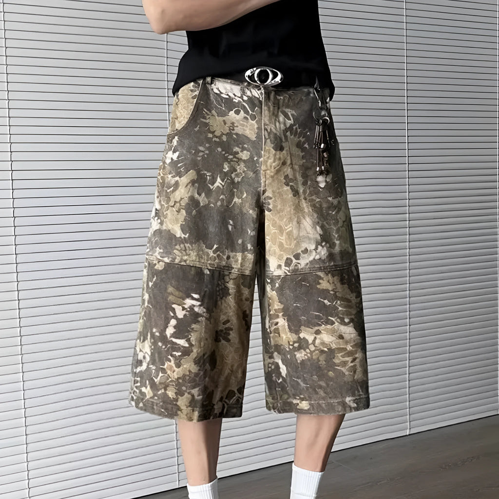 Yellow snake pattern camouflage cropped jeans on a neutral background