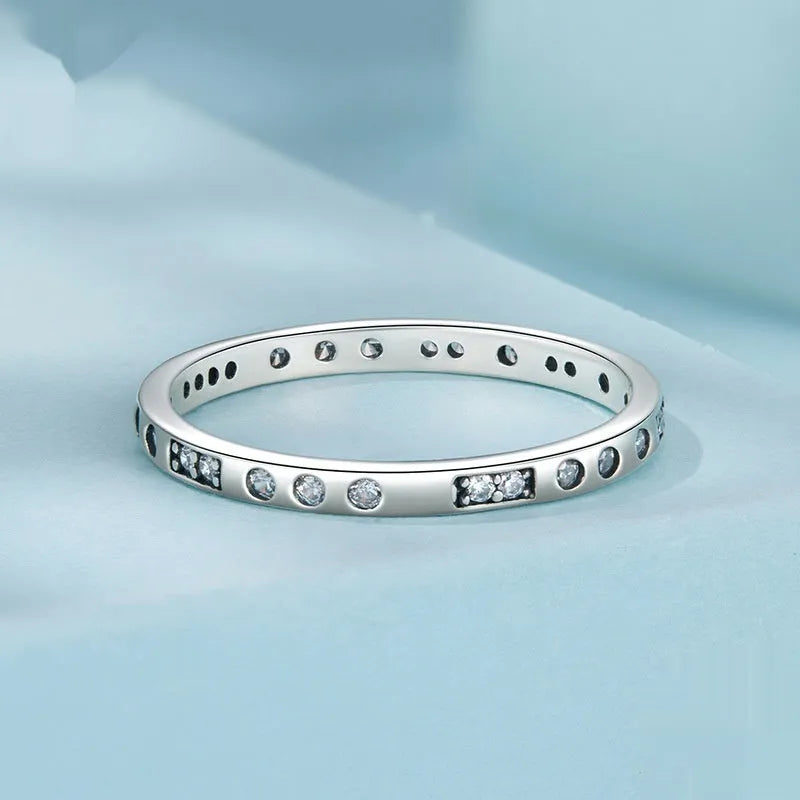 Silver alloy ring with oxidised black finish showing Moss Password I Love You design detail on band.