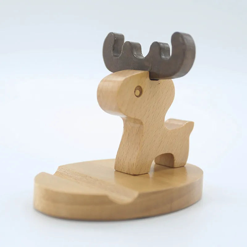 Beech wood mobile phone holder stand with coin slot and decorative carving.