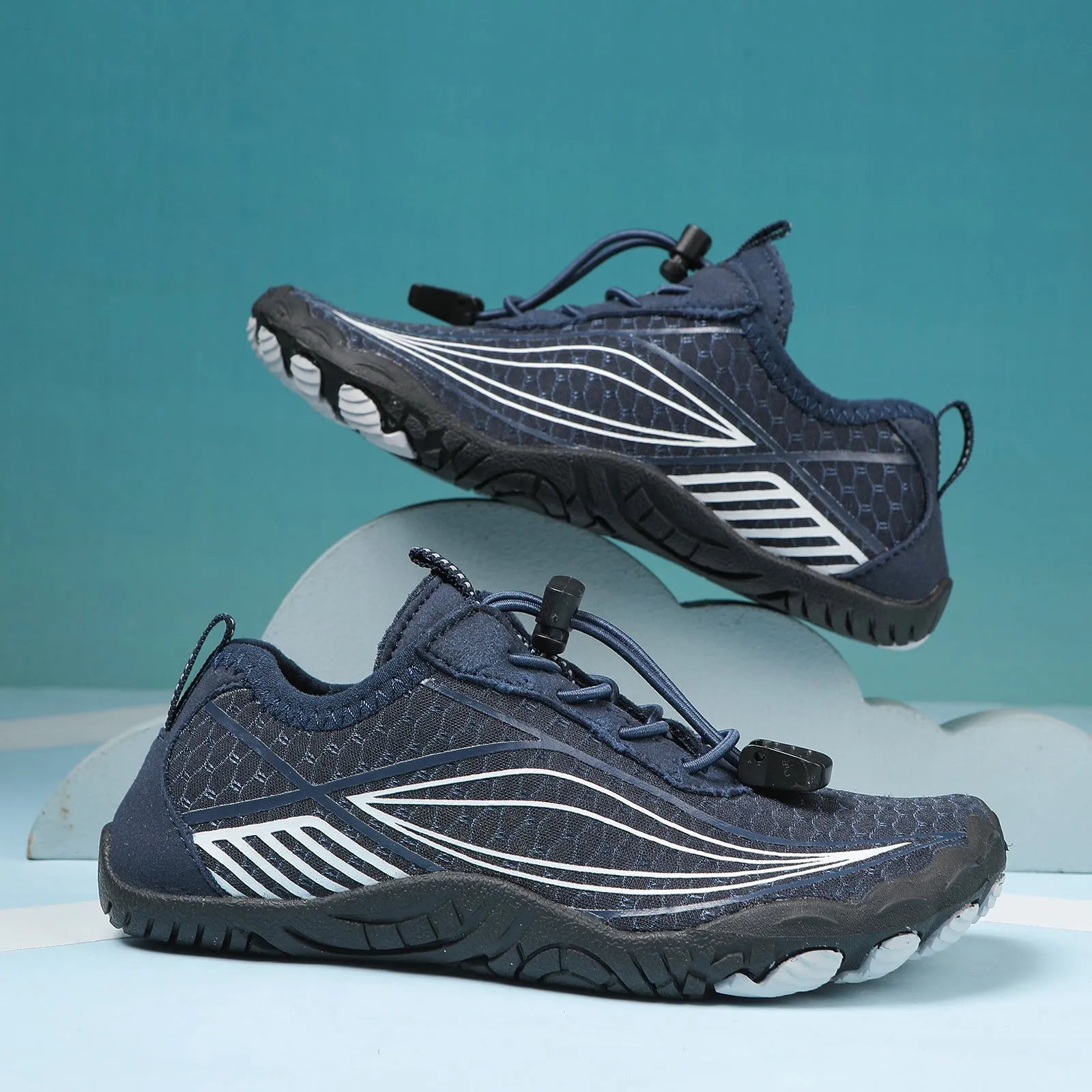 Children's black quick-drying water shoes with a non-slip rubber sole and elastic band.