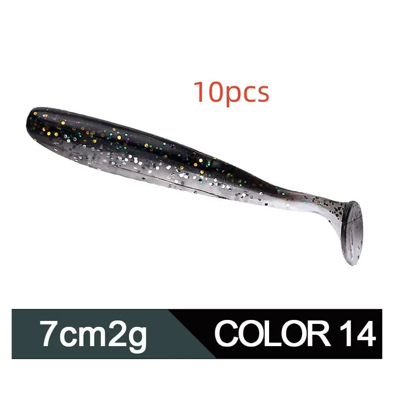 Soft plastic T-tail fishing lure in two-tone mandarin fish pattern, 7cm long.