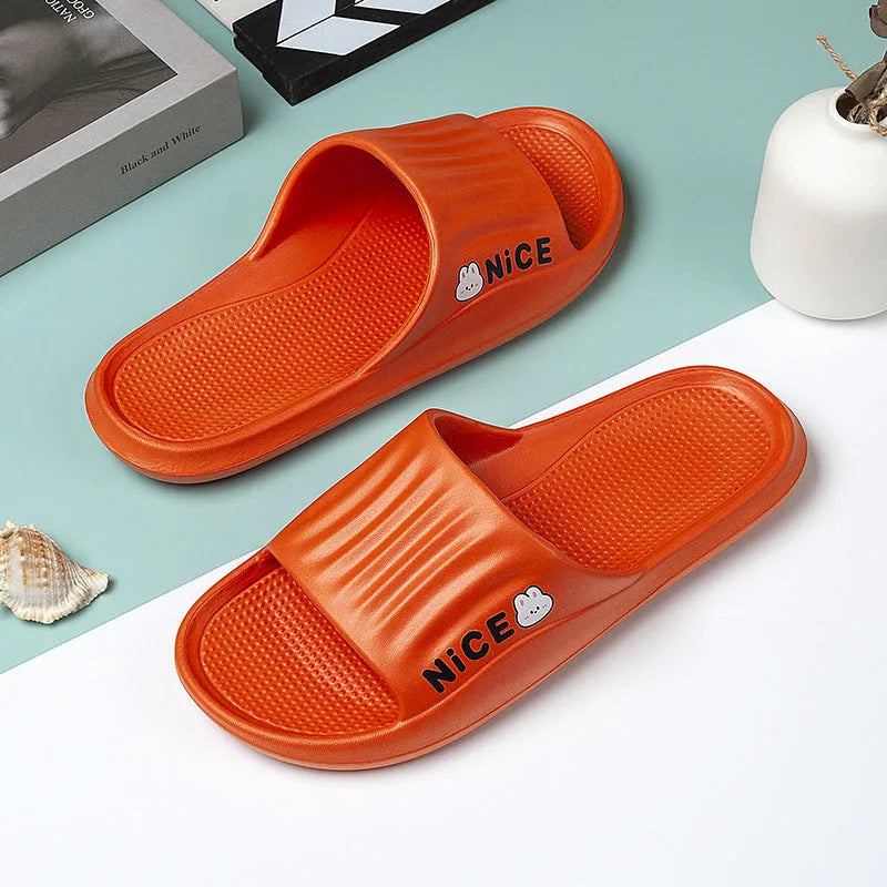 Adult unisex cartoon pattern EVA flip flop slippers in various colours on a white background.