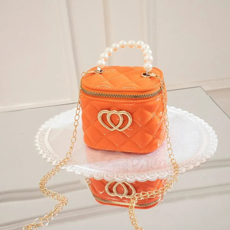 Transparent PVC bucket bag with a heart pattern, shown in one of seven available colours.