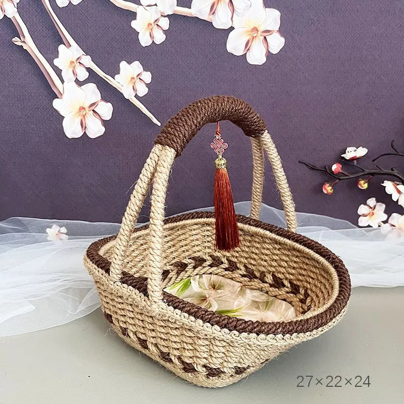 Coffee brown hand-woven straw basket with hemp rope detailing, 19cm long by 12cm wide