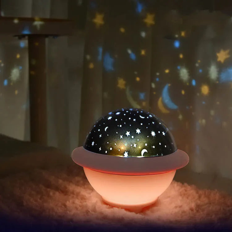 UFO-shaped plastic starry sky projection light in green colour showing rotating LED display