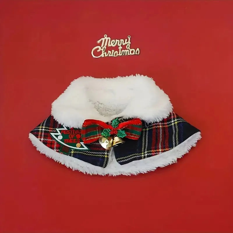 Pet wearing red Christmas cloak with bell design, draped over back with festive snowflake pattern
