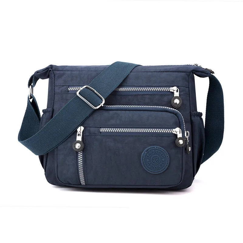 Nylon messenger shoulder bag in square vertical design with single strap and lining