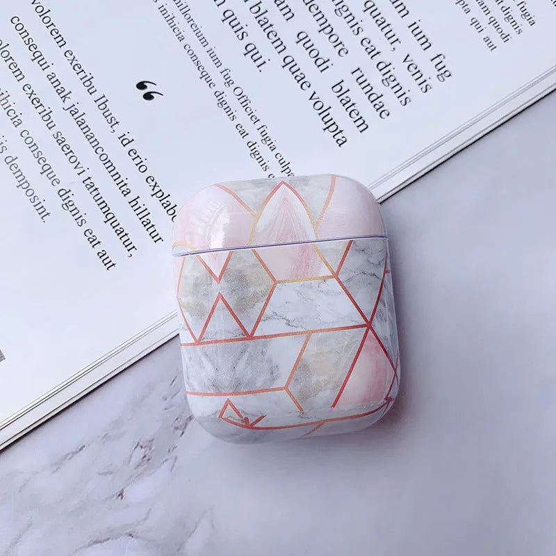 White marble protective case for Apple AirPods charging box showing hard PC construction