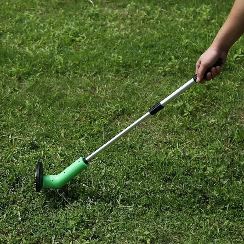 Cordless lawn trimmer with extension pole and protective shield on a garden background