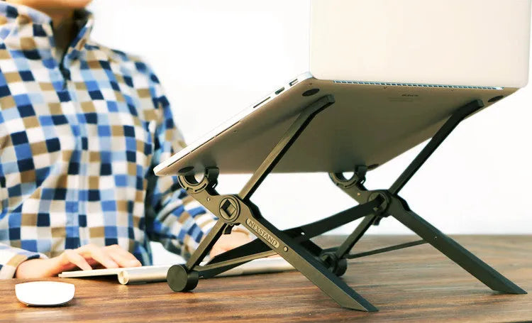 Black reinforced nylon portable folding laptop stand with 35.4cm width, shown in folded position.