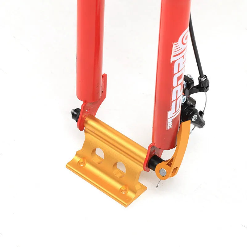 Silver metal quick release fixing clamp for a bicycle front fork.