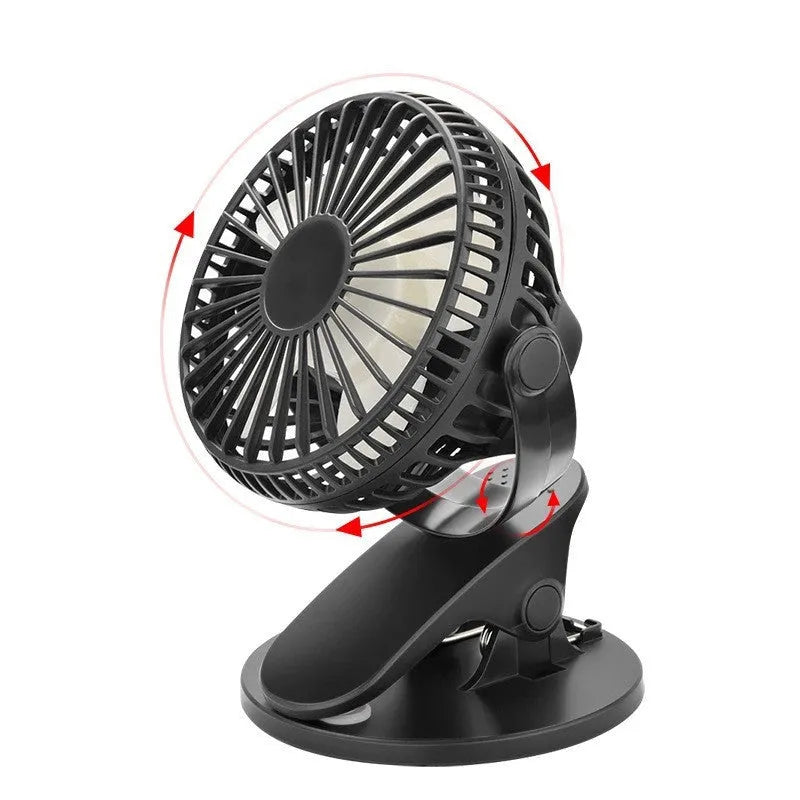 Small white clip fan with plastic blades attached to a surface, showing USB cable and piano button switch.
